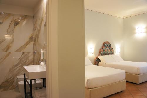 Katil atau katil-katil dalam bilik di Hotel Galileo