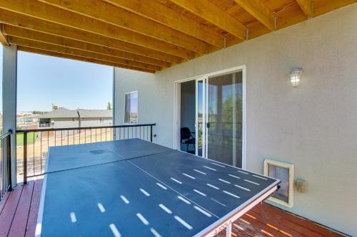 a blue ping pong table on a balcony at Panoramic Views Spacious Home in Cedar City! in Cedar City