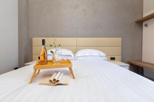 Ένα ή περισσότερα κρεβάτια σε δωμάτιο στο Mesbeglia Luxury Rooms