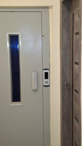 a door to a room with a window and a microwave at Canary Hotel in Hurghada