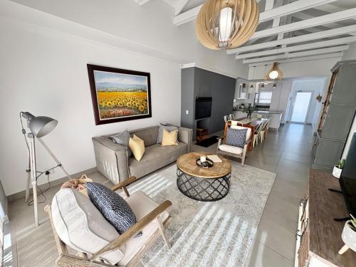 a living room with a couch and a table at Atlantic Dunes No 14 in Walvis Bay