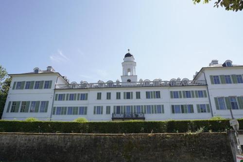 a white building with a lighthouse on top of it at F5 - 2 Zimmer Wohnung in Offenbach