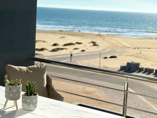 a balcony with a view of the beach at Atlantic Dunes No 14 in Walvis Bay