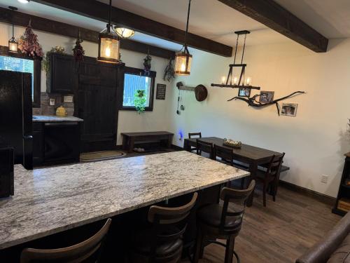 a dining room with a large table and chairs at The Ancient Bears Den By Avada Properties in Union Grove