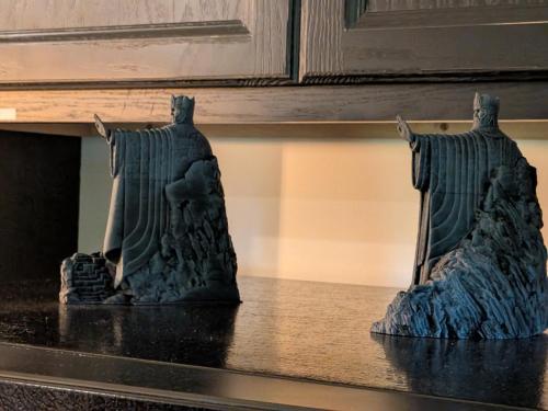 two statues of two people sitting on a table at The Ancient Bears Den By Avada Properties in Union Grove