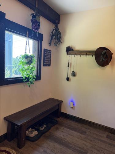 a room with a wooden bench and a window at The Ancient Bears Den By Avada Properties in Union Grove