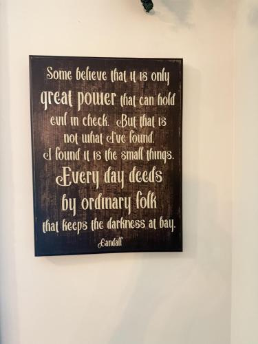 a picture of a sign on a wall at The Ancient Bears Den By Avada Properties in Union Grove