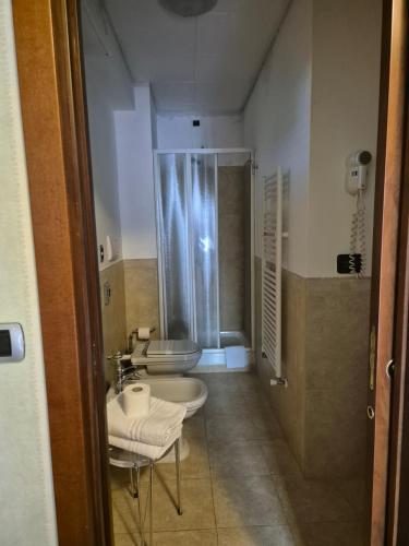a bathroom with a shower and a sink and a toilet at Pretoria Potenza in Potenza