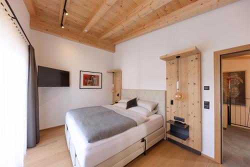 Postel nebo postele na pokoji v ubytování da Peatala Apartments