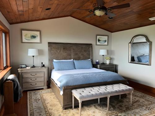 a bedroom with a bed and a ceiling fan at Hot Tub and Stunning Views Luxury Beech Mtn Escape! in Beech Mountain
