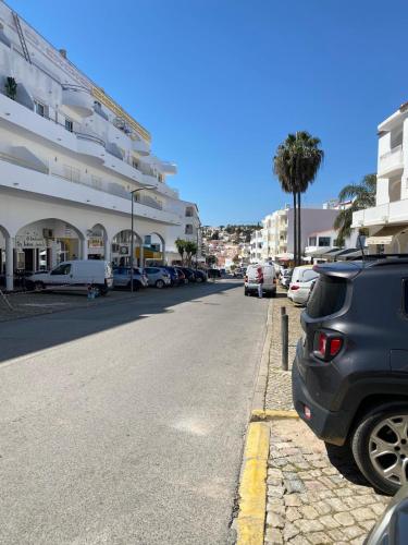 a car parked on the side of a street at Tropical House in Carvoeiro