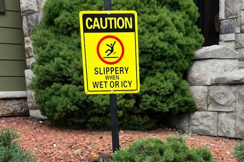 a yellow caution sign in front of a yard at Hot Tub and Stunning Views Luxury Beech Mtn Escape! in Beech Mountain