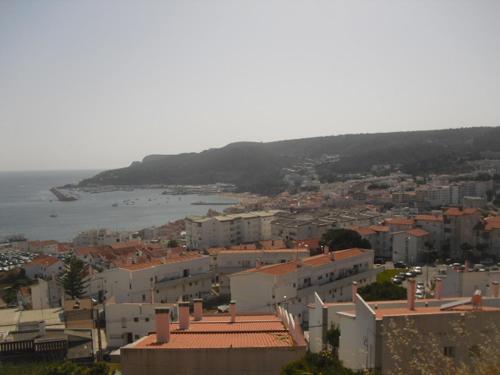 an aerial view of a city and the ocean at Casa Teresinha in Sesimbra