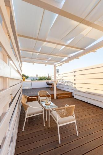 a deck on a yacht with chairs and a table at Schinosa 30 luxury room in Bisceglie