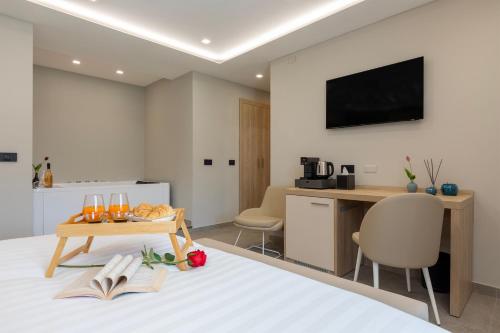 Μια τηλεόραση ή/και κέντρο ψυχαγωγίας στο Mesbeglia Luxury Rooms