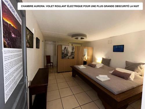 a bedroom with a large bed in a room at Vaste logement spa vue superbe Ti Kaz Miyou 1 in La Possession