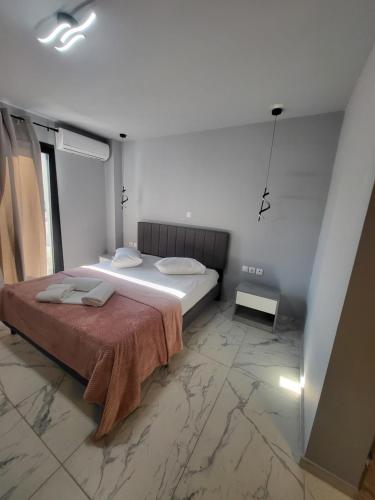 a bedroom with a bed with a red blanket at Diamond Piraeus Port in Piraeus