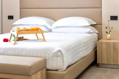 Ένα ή περισσότερα κρεβάτια σε δωμάτιο στο Mesbeglia Luxury Rooms