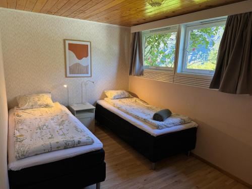 Katil atau katil-katil dalam bilik di Flåm Fjord Panorama House