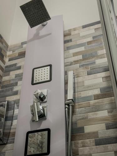 a bathroom with ailed staircase with a light on the ceiling at Design Moderno - Appartamento Centrale con 2 Suite in Turin