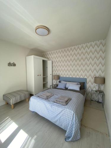 a bedroom with a bed in a room with at Aparthaus Olive in Torrevieja