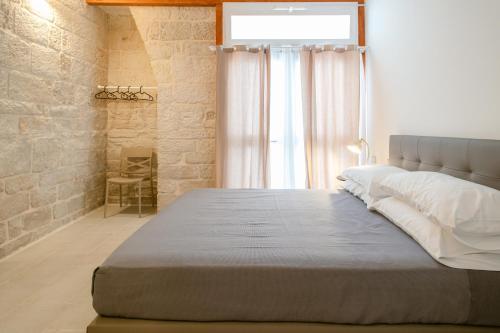 Ένα ή περισσότερα κρεβάτια σε δωμάτιο στο La Portulaca - Modern Central Rooms - Molfetta