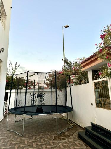 a metal trampoline on a patio in a house at Villa Kenitra in Kenitra
