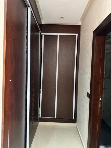 a room with a glass door and a glass door at Villa Kenitra in Kenitra