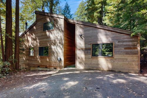 a large wooden house in the middle of a forest at Sequoia Sunset in Gualala