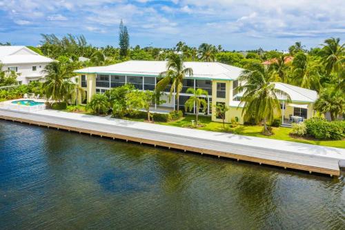an aerial view of a house next to a body of water at Snug Harbour View Condo #2 in George Town