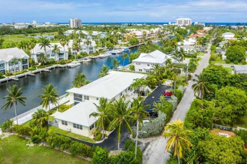 an aerial view of a canal with houses and palm trees at Snug Harbour View Condo #9 in George Town
