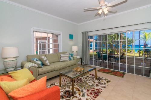 a living room with a couch and a ceiling fan at Northern Lights #4 Condo in Old Man Bay