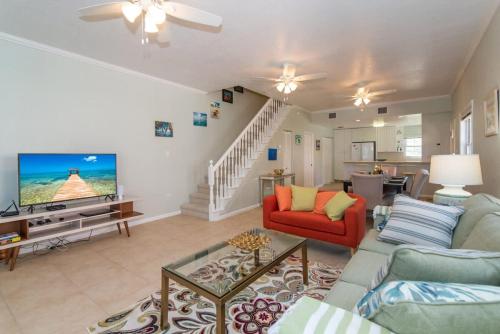 a living room with a couch and a tv at Northern Lights #4 Condo in Old Man Bay
