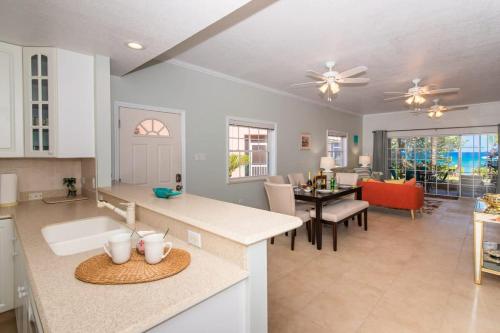 a kitchen and living room with a dining room at Northern Lights #4 Condo in Old Man Bay