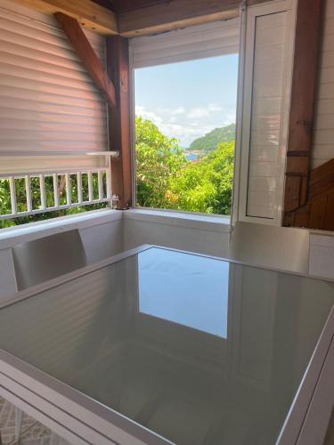 a window in a room with a view at Villa Lolyka in Terre-de-Haut