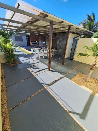 a house being constructed with a patio at Harmonious Villa in Flic-en-Flac with Private Pool in Flic-en-Flac