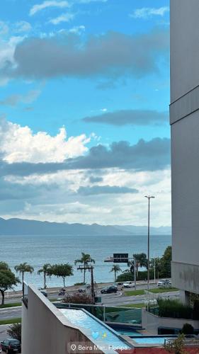 a view of the ocean from a building at Refúgio Sofisticado Beira Mar in Florianópolis