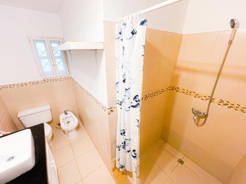 a bathroom with a shower and a toilet at LOS CORALES Resort VILLAS & Apartments WIFI BEACH Club & SPA in Punta Cana