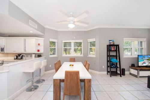 a kitchen and dining room with a table and chairs at On the Bay #103 Condo in Old Man Bay