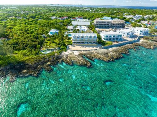 an aerial view of the resort and the ocean at Coconut Bay Villas #122 in George Town