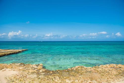 a view of the ocean from a beach at Georgetown Villas #201 in George Town