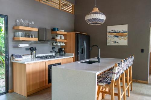 a kitchen with a sink and a counter top at Villa Asencia with pool and AC near Arrecife beach in Punta Uva