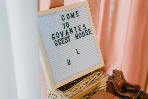 a sign that says come to companies best house at The Bistro House - Loft Unit - Vigan in Vigan