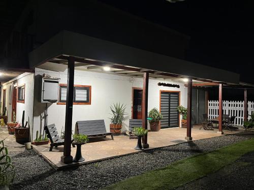a house with a black awning on a patio at night at El Relajo de Santa Cruz in Estación Colchagua