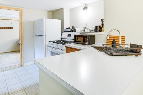 a kitchen with a stove and a refrigerator at Pet-Friendly Abode, 2 Mi to Dtwn Evanston! in Evanston