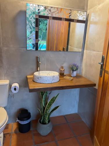 a bathroom with a sink and a mirror at Colonial Style House in Villarrica