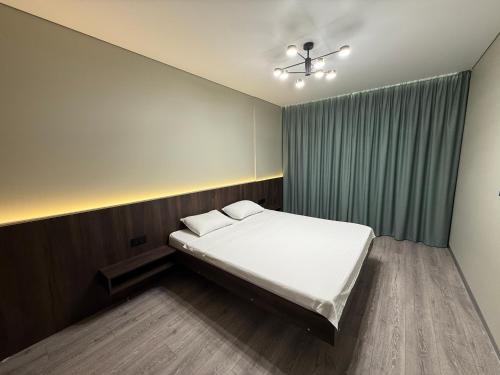 Ένα ή περισσότερα κρεβάτια σε δωμάτιο στο ЖК Новий Автограф