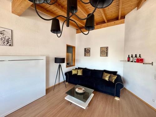 a living room with a couch and a table at Haus EMG Hockenheim in Hockenheim