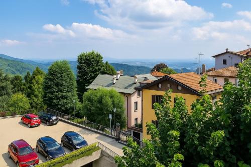 a group of cars parked in a parking lot at Appartamenti Monti Como Lake in Brunate