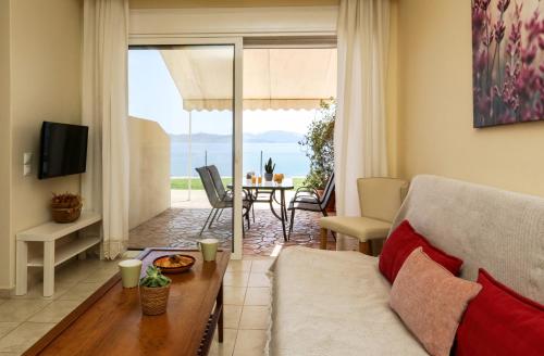 a living room with a couch and a table at Kiveri Gems Houses in Kivérion
